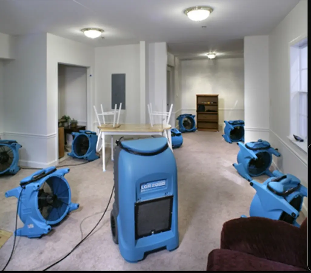 Air movers and dehumidifier setup for Water Damage Restoration in Aztec
